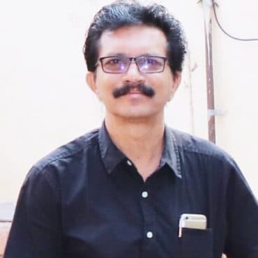 Portrait of SRI Kotresh Andanur, Director at DHUSBN